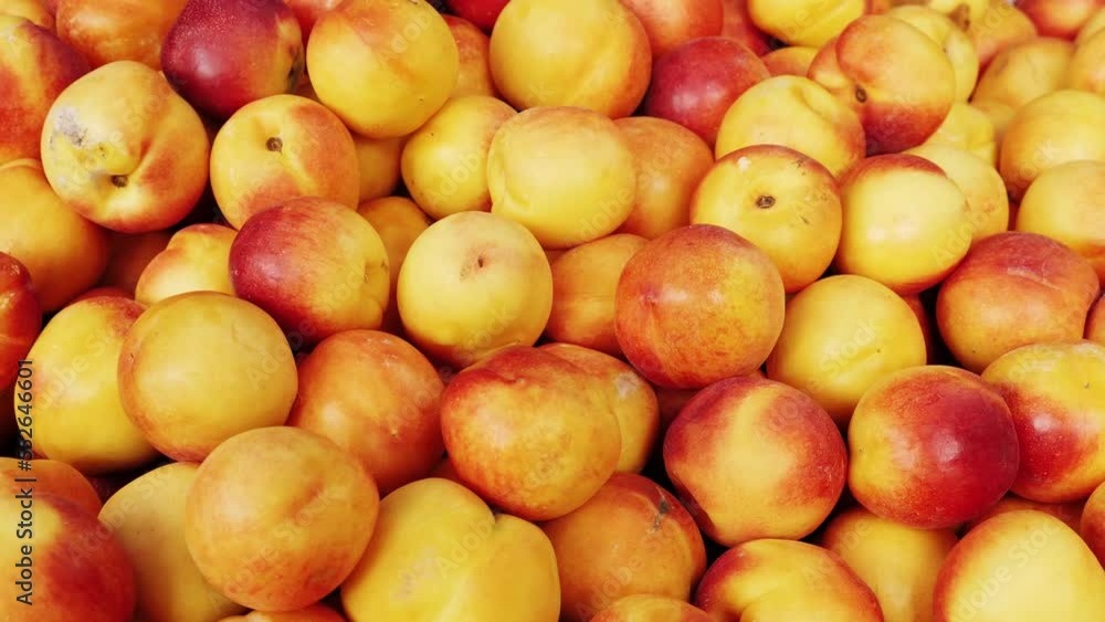 A group of colorful nectarine fruits on a market A group of colorful nectarine fruits on a market