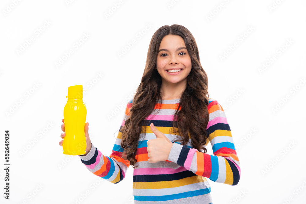Girl teen hold water bottle. Water bottle and healthy life. Health and water balance. Drink and beverage concept. Happy girl face, positive and smiling emotions. Girl teen hold water bottle. Water bottle and healthy life. Health and water balance. Drink and beverage concept. Happy girl face, positive and smiling emotions.