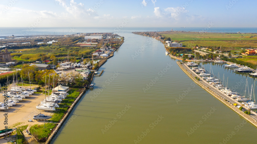 Aerial view of the Tiber River estuary in the Tyrrhenian Sea. It is located in the municipality of Fiumicino near Rome, Italy.
