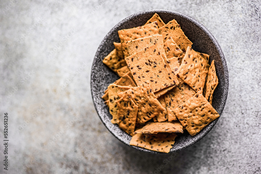 Bowl of flax and sesame seeds chips Bowl of flax and sesame seeds chips