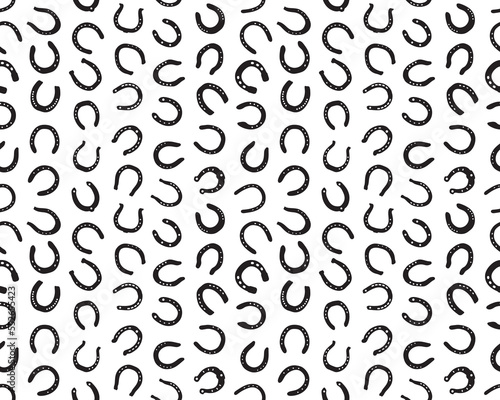 Black silhouettes of horseshoe on a white background, seamless illustration