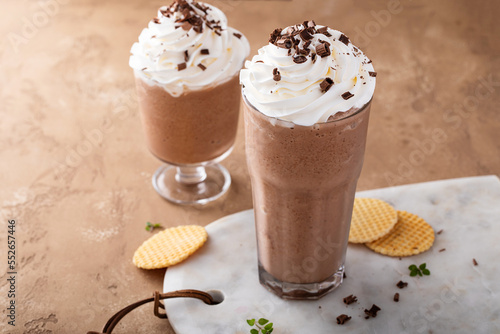 Coffee frappe topped with whipped cream and chocolate curls photo