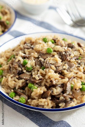 Homemade Mushroom Risotto with Peas on a Plate, side view. Close-up.