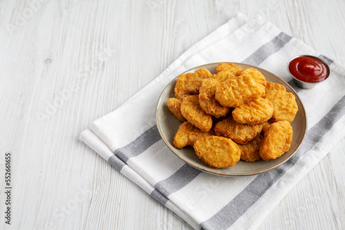 Homemade Chicken Nuggets with Ketchup, side view.