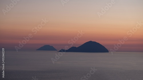 Aeolian Islands, Sicily. At sunset, the silhouettes of Filicudi and Alicudi islands, from Salina island. © from_south