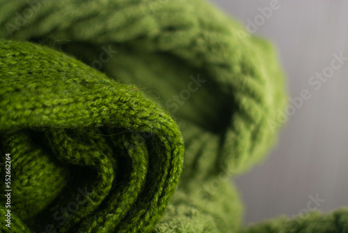 Obraz na płótnie Monochrome background of cozy green knitted sweater w salonie