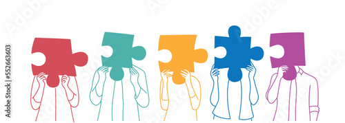 Different of multiethnic people holding different puzzle pieces.
