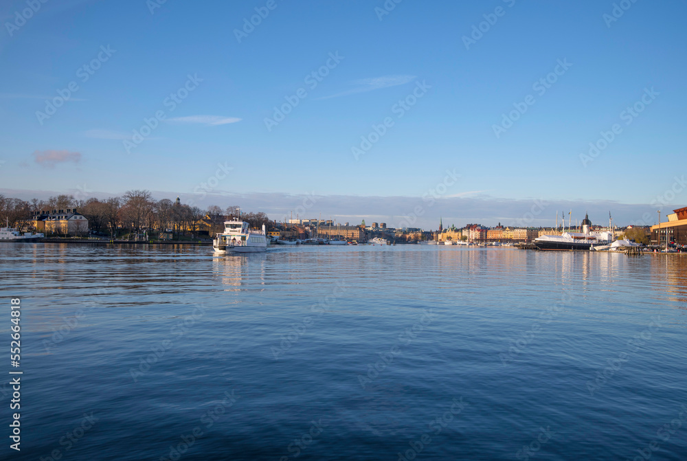 Harbor ferry in the bay Ladugårdsviken a sunny winter day in Stockholm
