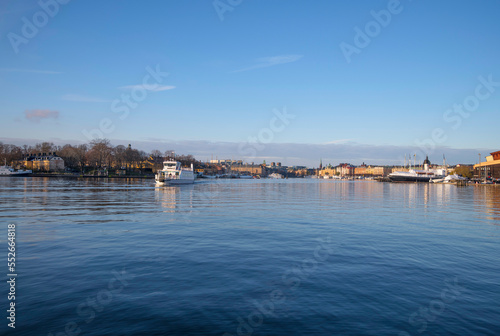 Fototapeta Naklejka Na Ścianę i Meble -  Harbor ferry in the bay Ladugårdsviken a sunny winter day in Stockholm