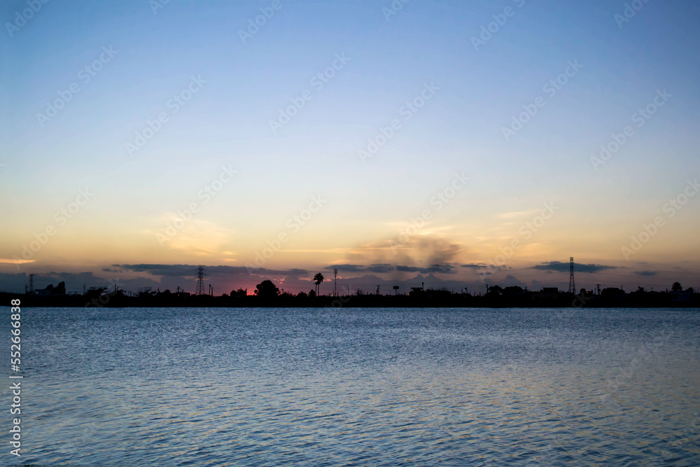 Sky and water Pollution of the environment at sunset Night horizon
