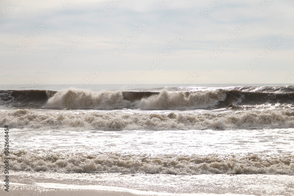 Frontal views of waves from the beach. A cloudy day. Frontal views of waves from the beach. A cloudy day.