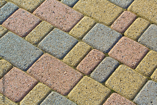 Colored concrete self locking flooring blocks assembled on a substrate of sand - type of flooring permeable to rain water as required by the building laws