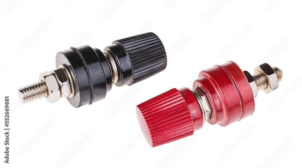 Red and black binding post connector with screw threaded terminal isolated on a white background. Close-up of electrical fasteners for bare wire clamping on electronic test equipment or other devices. Red and black binding post connector with screw threaded terminal isolated on a white background. Close-up of electrical fasteners for bare wire clamping on electronic test equipment or other devices.