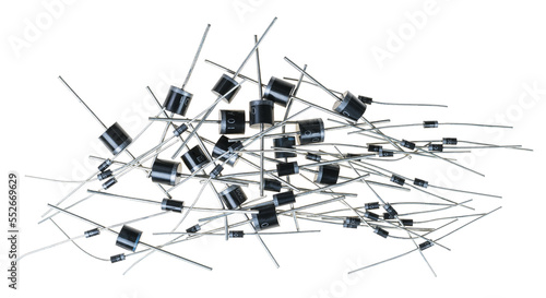 Various semiconductor silicon rectifier diodes isolated on a white background. Group of different types and sizes two-terminal electronic components as Zener or Schottky diode. Electrical engineering. photo