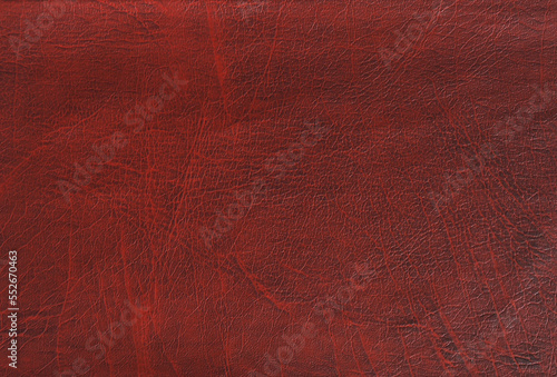  Red- brown abstract textured cracked leather background. Top view, flat lay