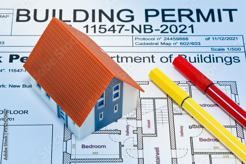 Building Permit concept with imaginary building approvation and photo