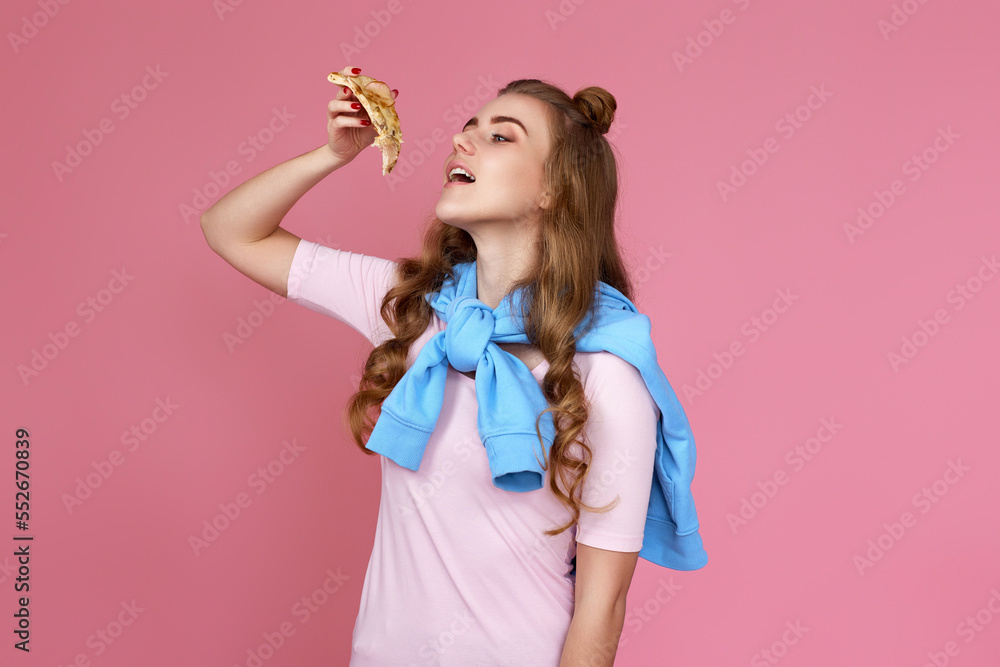 woman eating pizza slice and looking delighted woman eating pizza slice and looking delighted
