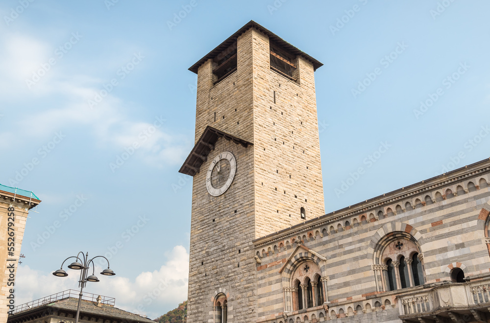 The civic tower with clock of the Como Cathedral in historic center of Como, Lombardy, Italy