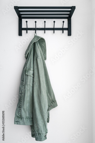 Tableau sur toile Denim jacket hangs on a hook in the hallway