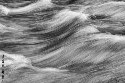 Image of water flowing in a long exposure in the Klondike River; Dawson City, Yukon, Canada photo