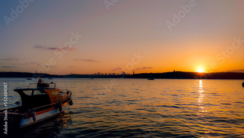 sunset on the sea with ship © enes