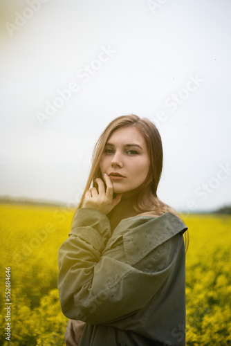 Cheerful girl in the field in summer