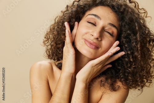 Woman beauty face close-up skin health nails and hair, hair dryer style curly afro hair, body and beauty care concept