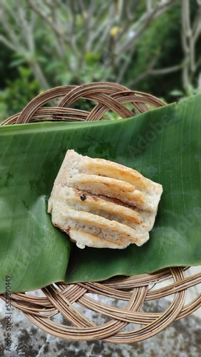 Kue pancong  or bandros (in Sundanese) traditional snack made of a rice flour and coconut-based batter and cooked in a special mold pan.  photo