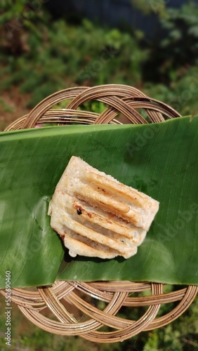 Kue pancong  or bandros (in Sundanese) traditional snack made of a rice flour and coconut-based batter and cooked in a special mold pan.  photo