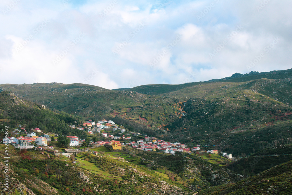 View from the top of the mountains of the Serra da Estrela natural park, village of Sabugueiro. Cloudy and rainy day. View from the top of the mountains of the Serra da Estrela natural park, village of Sabugueiro. Cloudy and rainy day.