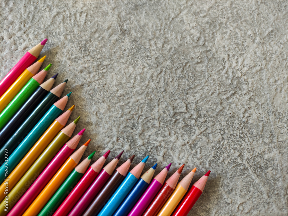 Pencil colors on gray textured background. Copy space image. Selective focus
Pencil colors on gray textured background. Copy space image. Selective focus