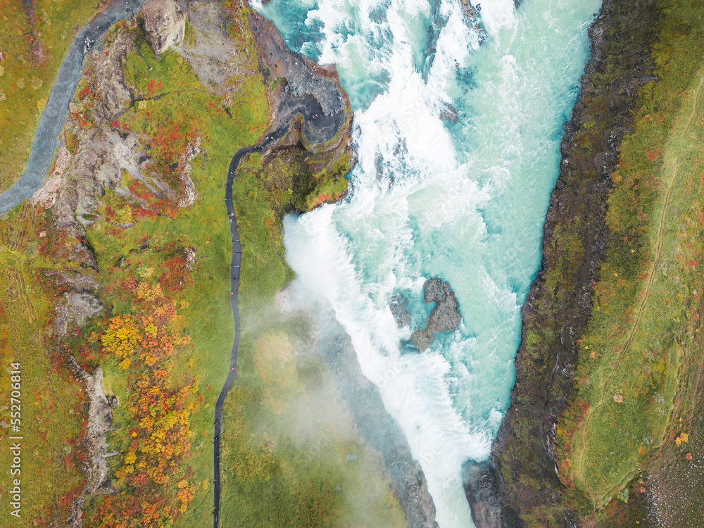 Naklejka premium Directly above the Gullfoss waterfall with foamy water falling down the rocks
