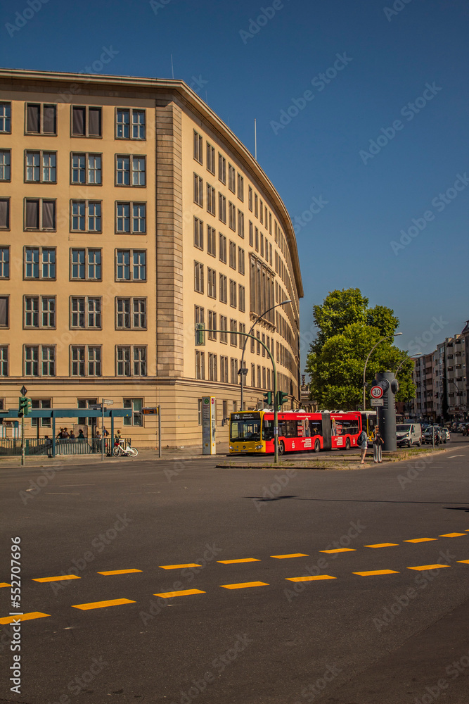 The street in Berlin. A cityscape with buildings, trees and buses.