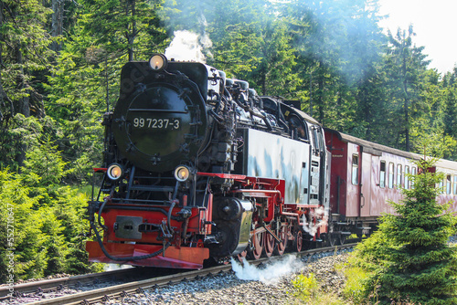 Antique steam locomotive in the Harz mountains photo