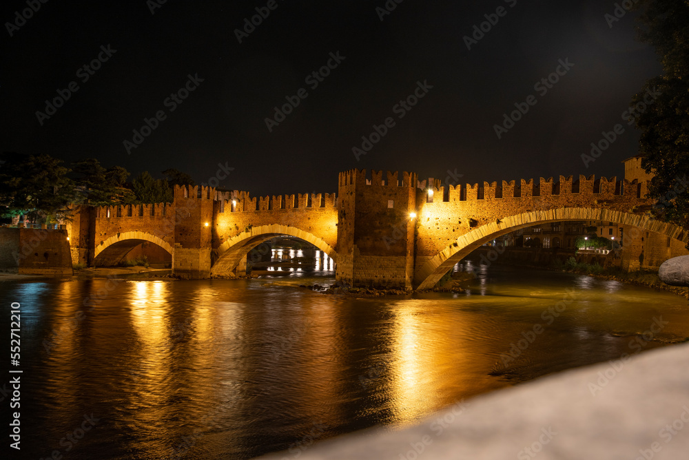 VERONA, ITALY - OCTOBER 16, 2021 - Castlevecchio Bridge over the Adige River in Verona at Night VERONA, ITALY - OCTOBER 16, 2021 - Castlevecchio Bridge over the Adige River in Verona at Night