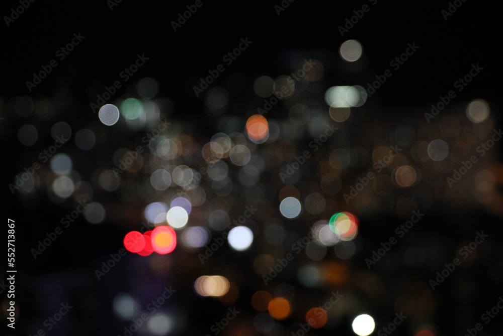 Blurred view of cityscape at night. Bokeh effect
