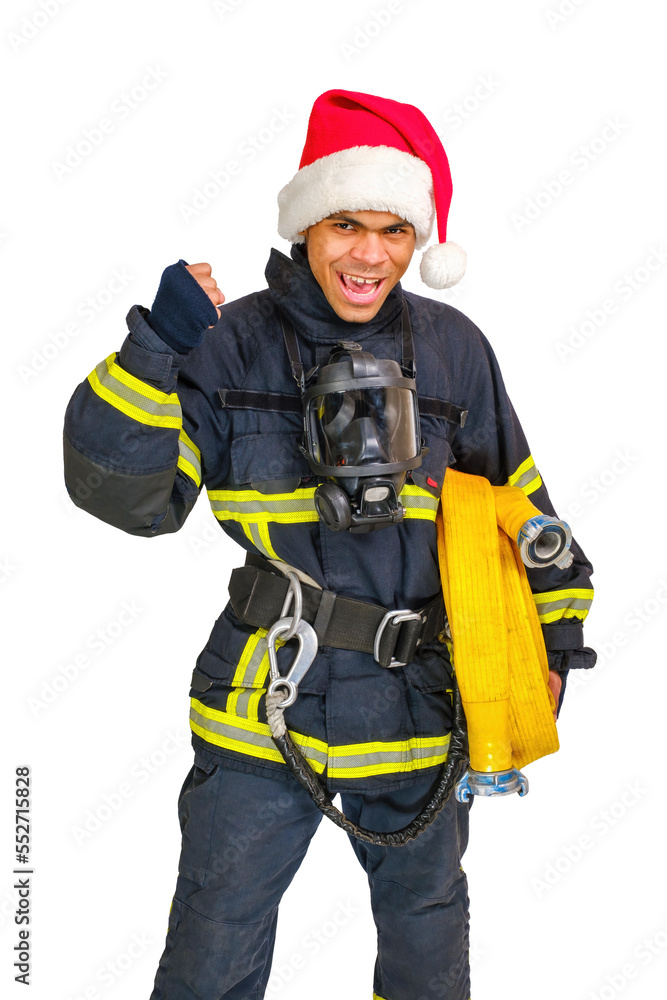 Exited young African American fireman in uniform and red Santa Hat holds fire hose in hand and looking at camera isolated on white background, vertical orientation Exited young African American fireman in uniform and red Santa Hat holds fire hose in hand and looking at camera isolated on white background, vertical orientation
