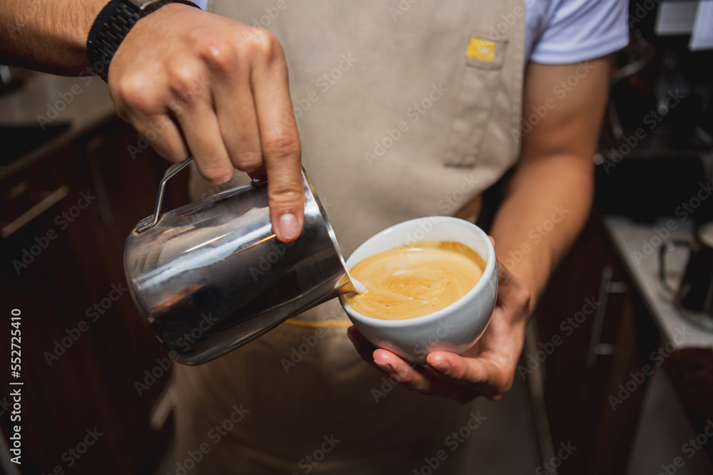 close up of barista making cappuccino coffee