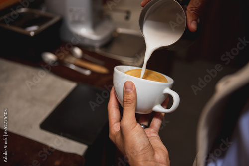 close up of barista making cappuccino