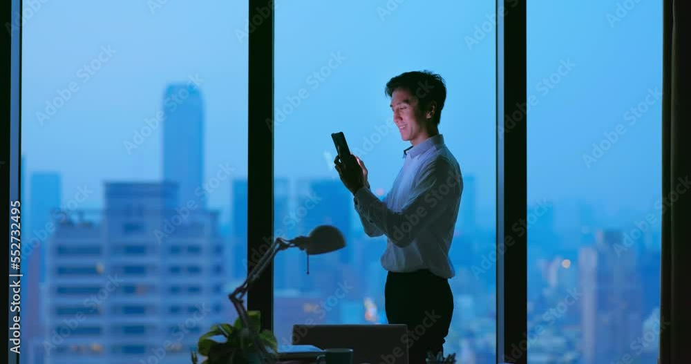 Business man uses cellphone Business man uses cellphone