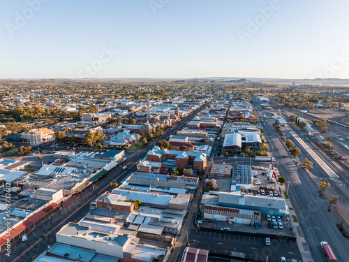 Morning sunrise high angle aerial drone view of the Central Business District of outback mining town Broken Hill  New South Wales  Australia. Argent Street on the left  Crystal Street on the right.