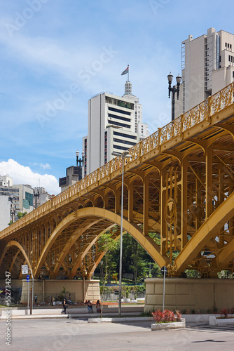 SAO PAULO - DECEMBER 07, 2017: Famous Santa Ifigenia Viaduct in downtown Sao Paulo on a sunny day with some people waiting for buses at the Bus Terminal located below the viaduct 
