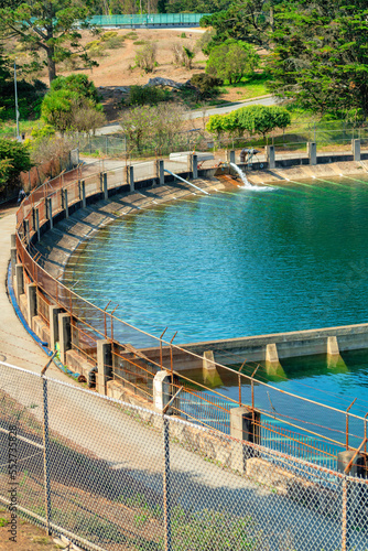 fenced off water reservoir with metal boundaries