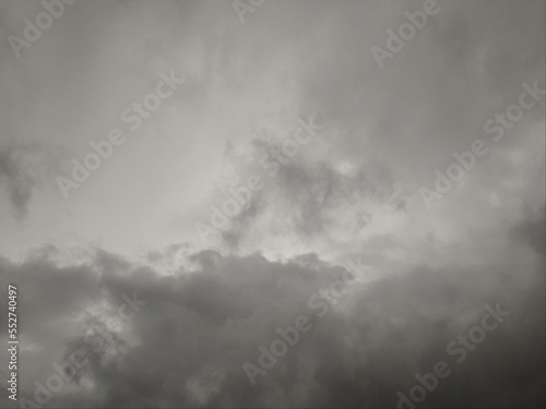View of overcast sky. Dramatic gray sky and white clouds before rain in rainy season. Cloudy and moody sky. Storm sky. Cloudscape. Gloomy and moody background.