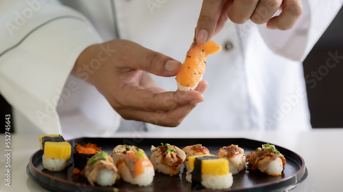 Chef cooking sushi in the kitchen