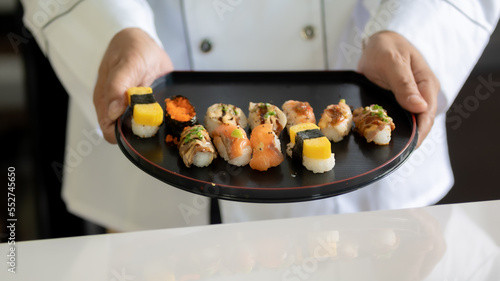 Canvas Print Chef cooking sushi in the kitchen