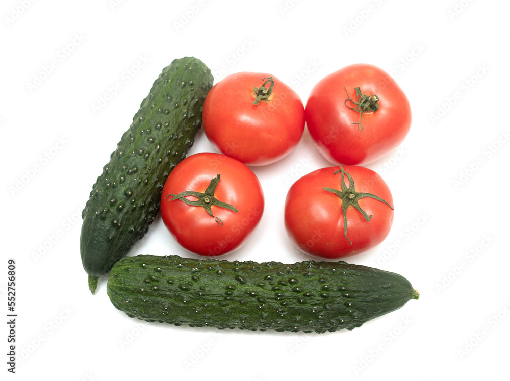 Red ripe tomato and green cucumber on a white background. Red ripe tomato and green cucumber on a white background.