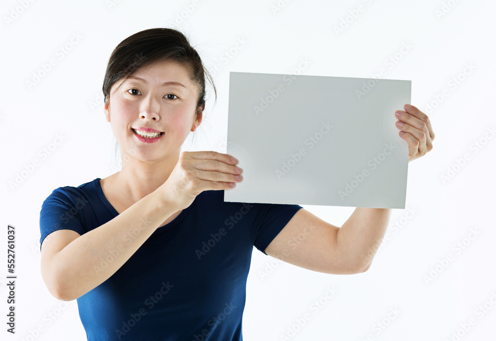 Beautiful asian woman holding a blank board isolated on white background Beautiful asian woman holding a blank board isolated on white background