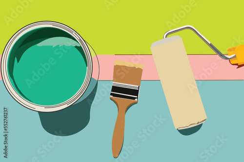 Green paint cans, a brush and a roller to paint the walls of the house seen from above