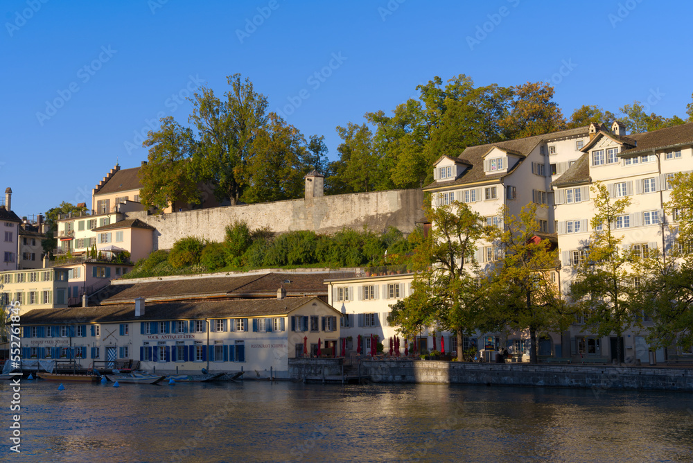 Scenic view of the old town of City of Zürich with Limmat River and historic houses on a sunny late summer morning. Photo taken September 22nd, 2022, Zurich, Switzerland. Scenic view of the old town of City of Zürich with Limmat River and historic houses on a sunny late summer morning. Photo taken September 22nd, 2022, Zurich, Switzerland.